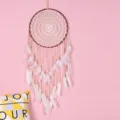 Handmade Bohemian dreamcatcher wall hanging with white feathers and wooden beads for decor. - 9050 Medium Size