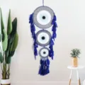 Blue three-ring dream catcher wall hanging with evil eye design and feathers for home decor. - 9520 Sapphire Blue 40cm Triple Ring