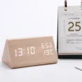 Wooden triangular LED digital desk clock close up showing time temperature and humidity. - Bamboo Wood White Light