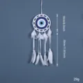 Attrape-rêves œil maléfique décoration murale plumes blanches et toile bleue tissée. - 9435 Blanc 16 cm