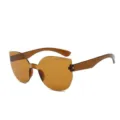 Braune einteilige Cat-Eye Sonnenbrille Bonbonfarbe rahmenlose Modesonnenbrille Damen Herren - Transparentes Teebraun