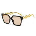 Chic gafas de sol cuadradas oversize con elegantes patillas de cadena metálica y cristales. - Montura Negra Lente Té Claro