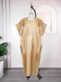 Detail of embroidered satin long dress, gold color, square neck, elegant casual style. - One Size / Dresses / Champagne