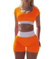 Detailed shot of the orange and white ribbed crop top and shorts yoga set, highlighting texture. - S / Top And Bottom / Orange