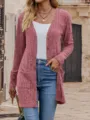 Close-up view of the pink knitted cardigan showing texture, V-neck, and front pockets. - S / Red