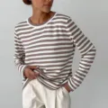 Detailed close-up view of the brown white striped long sleeve knit sweater texture. - S / Coffee