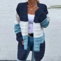 Detailed view of women's color block knitted cardigan sweater with long sleeves and pockets. - S / Blue & White