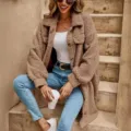 Detailed shot of a stylish fuzzy teddy coat featuring lapel collar and casual long design. - S / Tops / Khaki