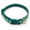 Green nylon pet collar detail with white paw print pattern, plastic buckle, and metal D-ring. - Dark Green