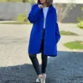 Detail view of a stylish royal blue hooded wool blend coat featuring long sleeves and snap buttons. - S / Blue