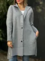 Detail view of the stylish grey hooded long sleeve woolen coat showing buttons and pocket design. - Gray