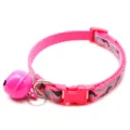 Close-up detail of the pink camo pet collar highlighting the durable buckle, ring, and cute bell. - Rose Red