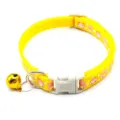 Close-up detail of yellow pet collar with cute cartoon pattern, safety buckle and golden bell. - Width 1.0cm, Adjustable Range 21-34cm / Yellow