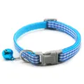 Detailed view of blue plaid pet collar with grey plastic buckle, metal ring and bell. - Blue