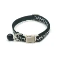 Detailed close-up of a 1cm pet collar featuring a stylish black and white cracked pattern with bell. - Black