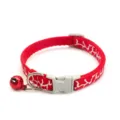 Detailed shot of red pet cat dog collar with white pattern, grey buckle and red bell. - Red
