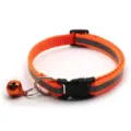 Detailed view of reflective orange pet dog collar featuring metal bell and secure plastic buckle - Width 1.0 cm, Adjustable Range 19-32 cm / Orange