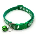 Green pet collar detail, nylon material with cute white paw print and crisp metal bell. - Green