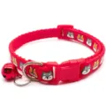 Detailed view of the red pet collar featuring cute cartoon animal prints, a bell, and buckle. - Red