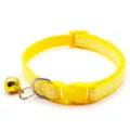 Detail view of yellow checkered pet collar featuring cute golden bell and secure buckle. - Yellow