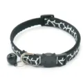 Detailed view of black and white printed pet collar with cat face buckle and bell. - Black