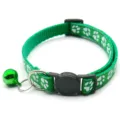 Green pet cat dog collar close-up, white paw print pattern, adjustable buckle with bell detail - Green