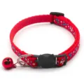Close-up red pet collar with blue bone print, cute cat buckle and red bell detail. - Red