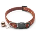 Detail view of brown pet collar featuring anchor print, cat shaped buckle and bell for small pets. - Coffee