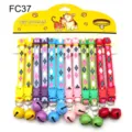 Detailed view of colorful pet collars with bells, argyle pattern and plastic buckles. - Width 1.0cm / FC37