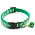 Green paw print pet collar detail, featuring quick release buckle and cute jingle bell. - Green