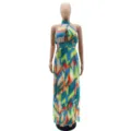 Detailed view of the halter neck, cutout detail, and colorful geometric pleated chiffon fabric. - S / Green
