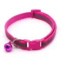 Pink reflective pet collar detail shot showing nylon strap, safety buckle and cute bell. - Rose Red