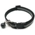 Close-up detail of the black reflective pet collar featuring a durable plastic buckle and bell. - Black