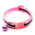 Detail view of pink reflective pet collar showing black stripe, safety buckle and cute bell. - Pink