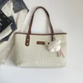Minimalist canvas tote bag with brown leather handles and cute plush charm for daily commute - With Pendant / Brown