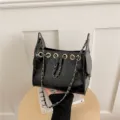 Black quilted bucket bag detail, luxury chain strap, stylish shoulder handbag for women. - Black