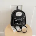 Detailed view of the black star pattern mini backpack featuring cute cat face embroidery and lace. - With Pendant / Black