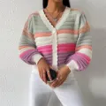 Close-up detail of women's colorblock striped V-neck lantern sleeve knit cardigan sweater. - S / Rainbow Stripes