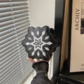 Black glitter snowflake crossbody bag with silver embroidery and stylish chain strap. - Black