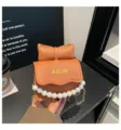 Bonito bolso cruzado naranja para niños con lazo y cadena de perlas, monedero elegante para niña. - Marrón
