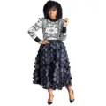 Detailed view of women fashion black mesh skirt with 3d polka dots and geometric sweater. - 1XL / Bottoms / Black