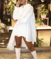 Detail shot of women white asymmetric long sleeve shirt with metal eyelet hollow details. - White