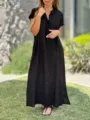 Solid color linen short sleeve button down maxi dress detail showcasing casual loose fit. - S / Dresses / Black