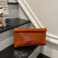 Orange crocodile pattern leather clutch bag, stylish and minimalist daily accessory for women. - Brown