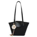 Chic black shoulder bag for women, minimalist bucket bag with cute flower pendant, summer style. - With Pendant / Black