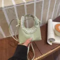Light green mini crescent crossbody bag with lace trim, trendy niche design purse. - Green