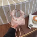 Pink mini crescent crossbody bag with delicate lace trim, stylish niche design for women. - Pink