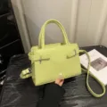 Lime green minimalist small square bag, fashionable single shoulder crossbody bag with belt detail. - Green