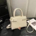 Elegant minimalist white crossbody bag for women, stylish small square handbag design. - White