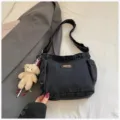 Fashionable denim shoulder bag for women, casual canvas crossbody dumpling bag with cute bear pendant. - With Pendant / Black